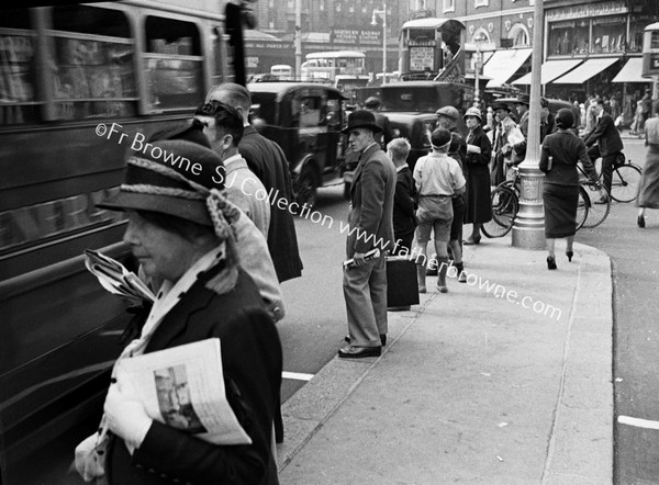 WAITING FOR A BUS IN VICTORIA STREET